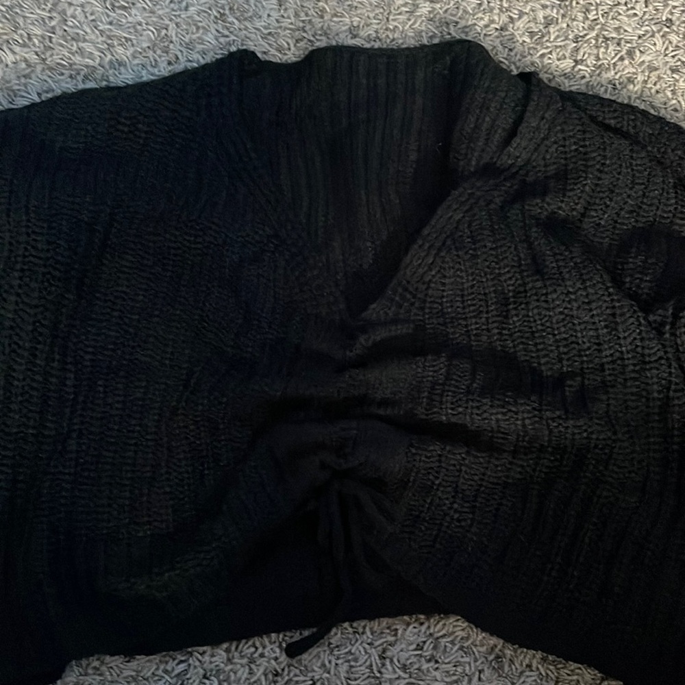 black sweater, adjust in the center